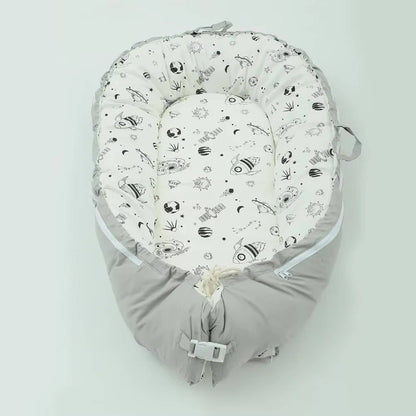 Reducteur-de-lit-bebe-sourire